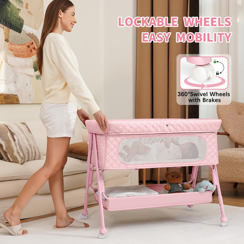 Kiniew bedside bassinet with lockable wheels for stable repositioning.