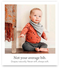 Kishu Baby Indi muslin-texture bib close-up reveals soft, breathable fabric.