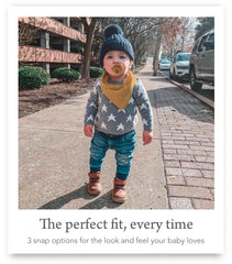 Kishu Baby Indi nickel-free snaps image demonstrates adjustable neck for growing babies.