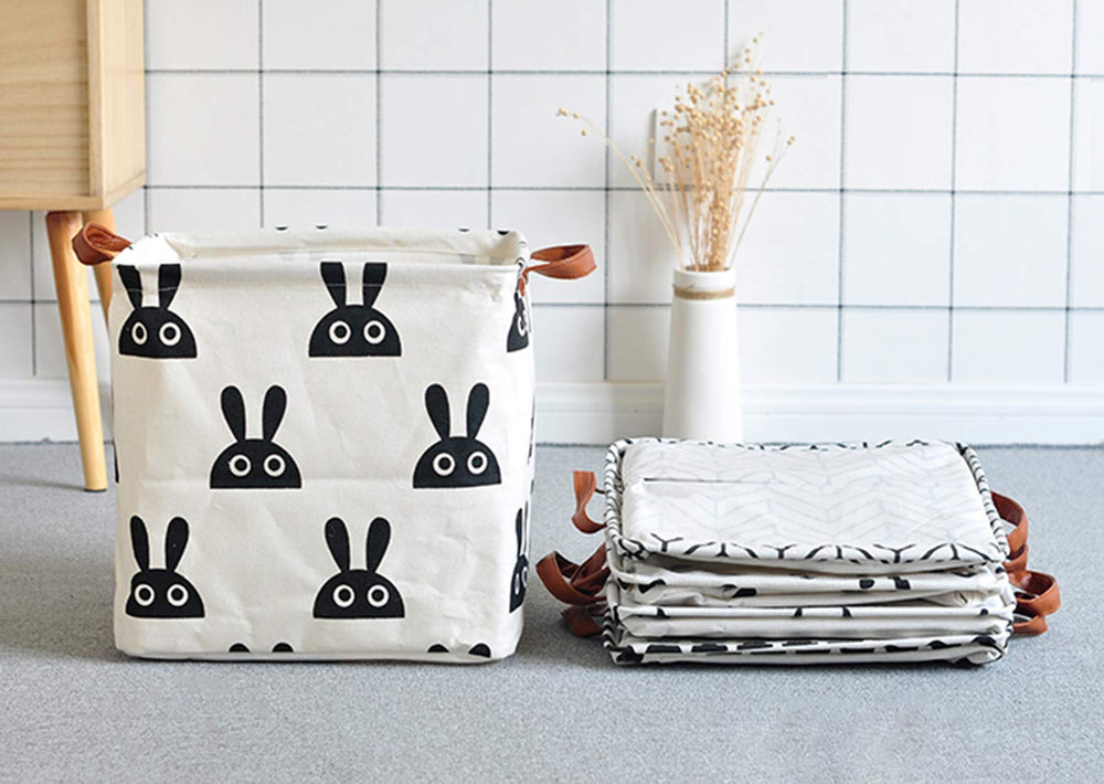 KIUATSJR square storage basket in nursery offers stylish storage for blankets and plush toys.