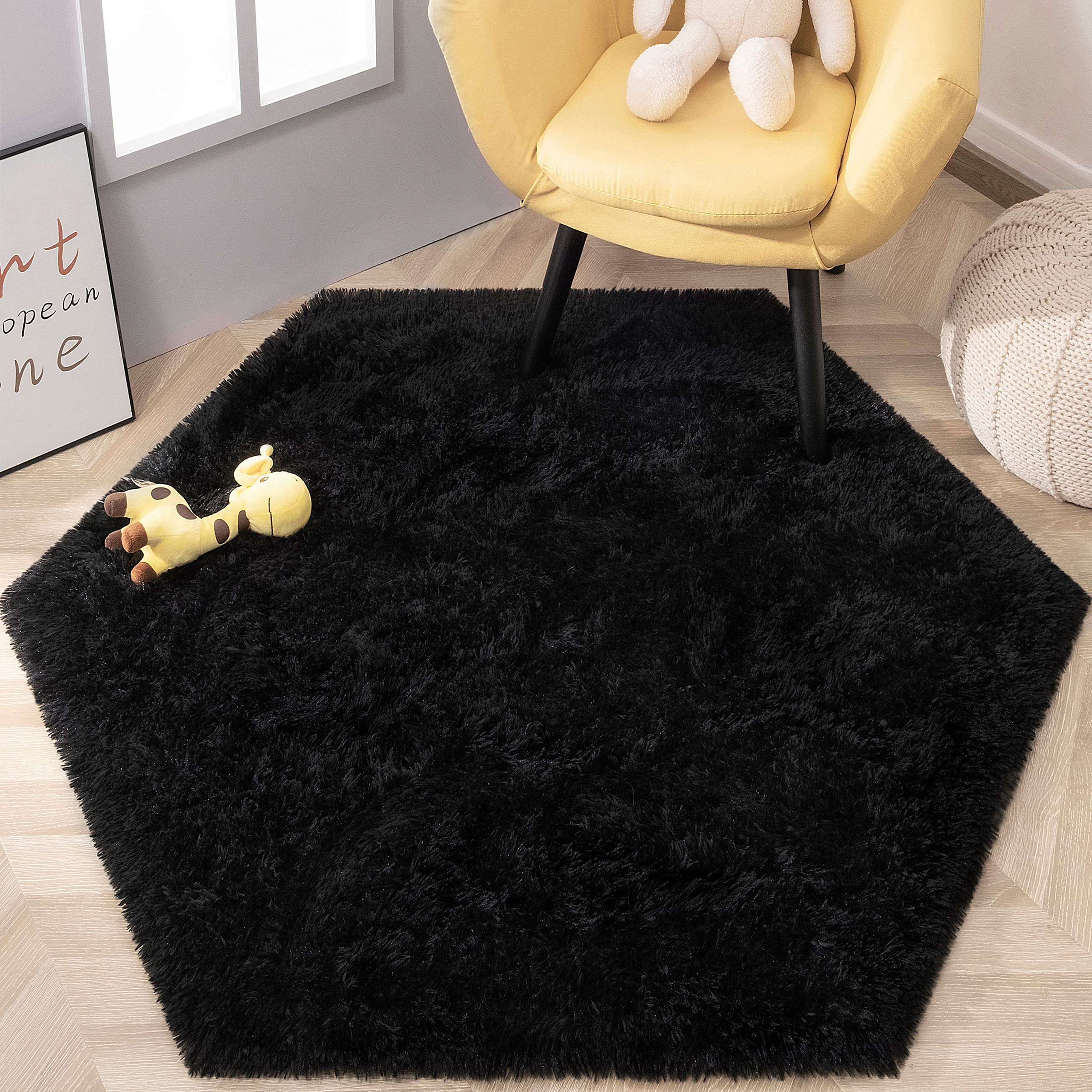 KIXINWA Black Hexagon Rug vacuum-pack unwrap reveals initial creases before recovery.