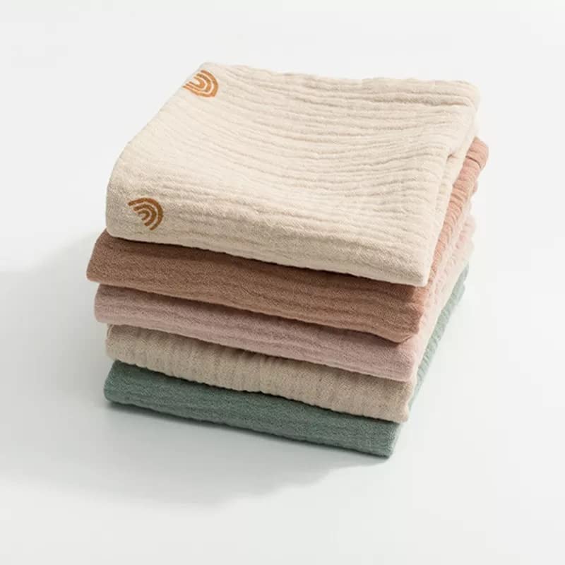 Kjuti pastel burp cloths folded, perfect for on-the-go messes and quick-dry use.