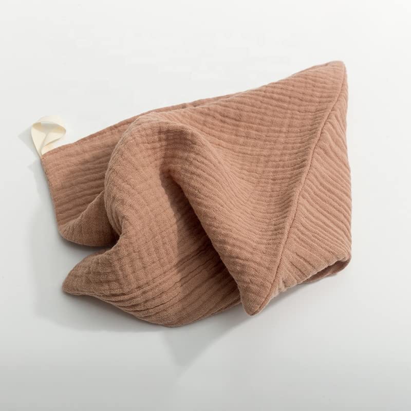 Kjuti muslin burp cloths in pastel stack, breathable and gentle on skin.