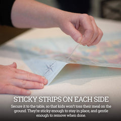 Klean Kids baby eating on placemat reduces mess and spills.
