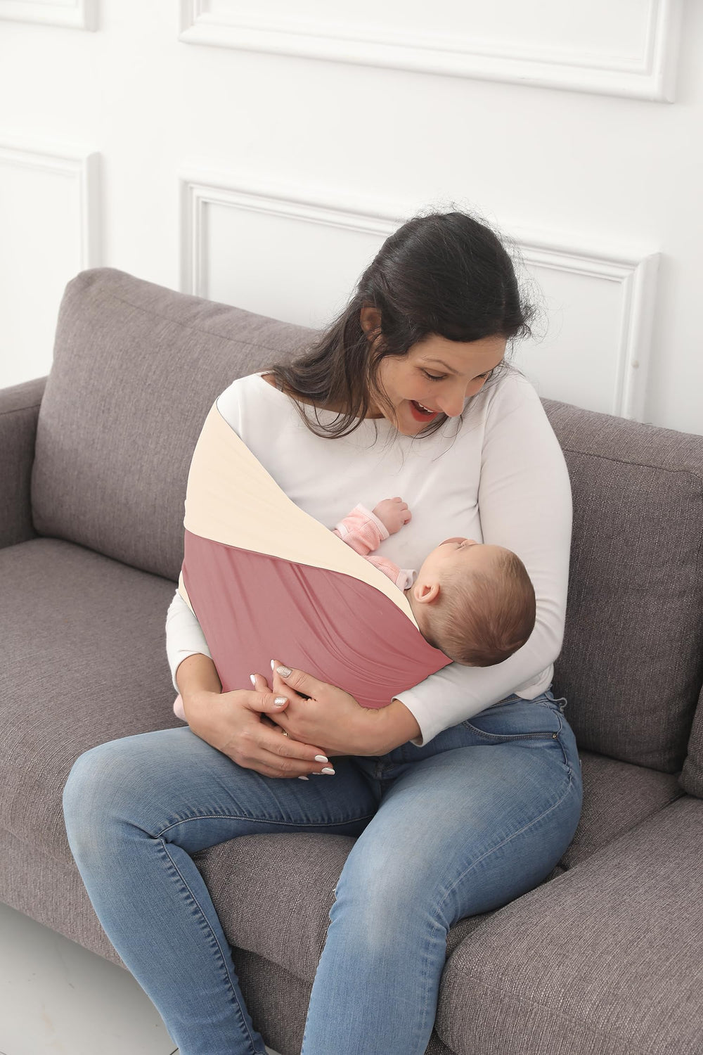 Kloovete baby in sling illustrates back support and reduced shoulder strain
