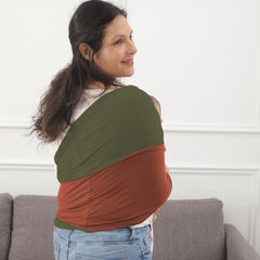 Kloovete baby wrap copper-olive mom wearing demonstrates hands-free mobility during chores.