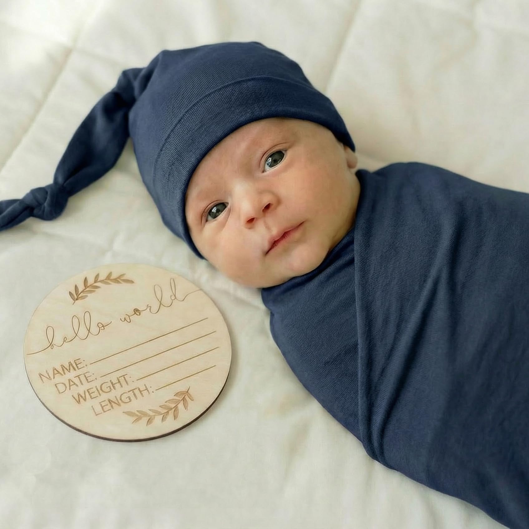 Kloovete newborn swaddled in navy blanket, cozy and breathable comfort