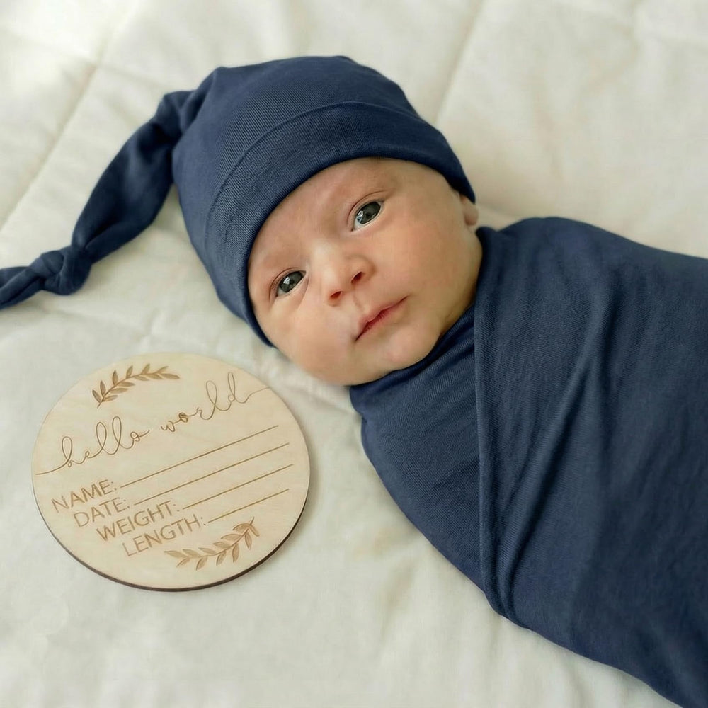 Kloovete newborn swaddled in navy blanket, cozy and breathable comfort