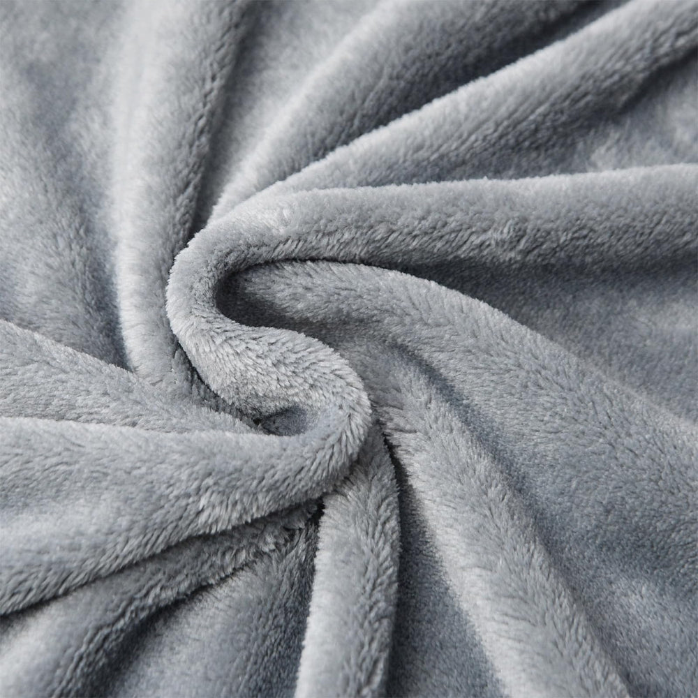 KMUSET grey on sofa shows versatile warmth during relaxed evenings.