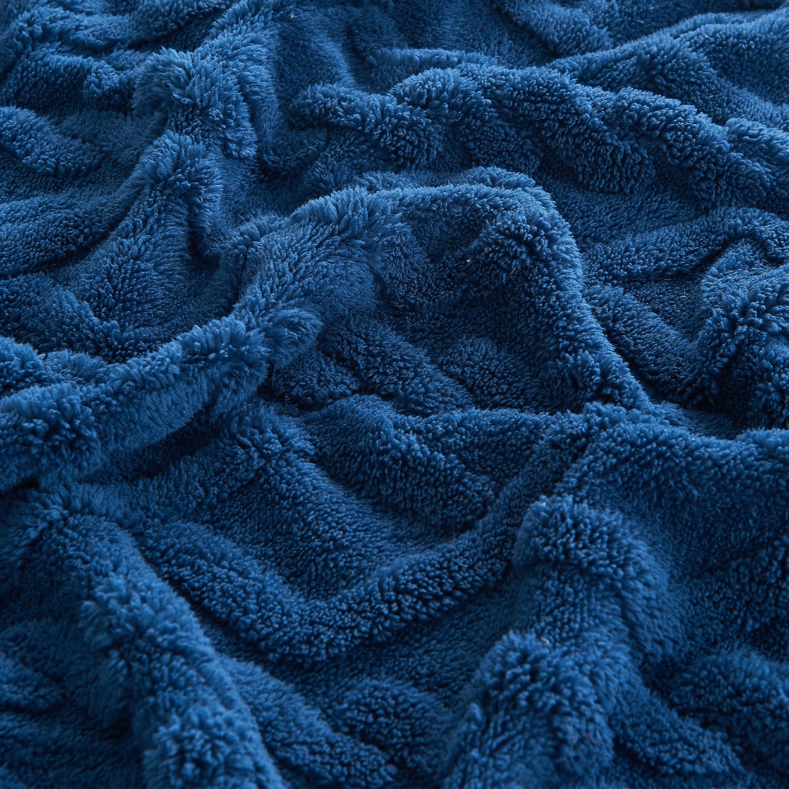 KMUSET Kids blue blanket texture close-up highlights soft fibers and durable weave.