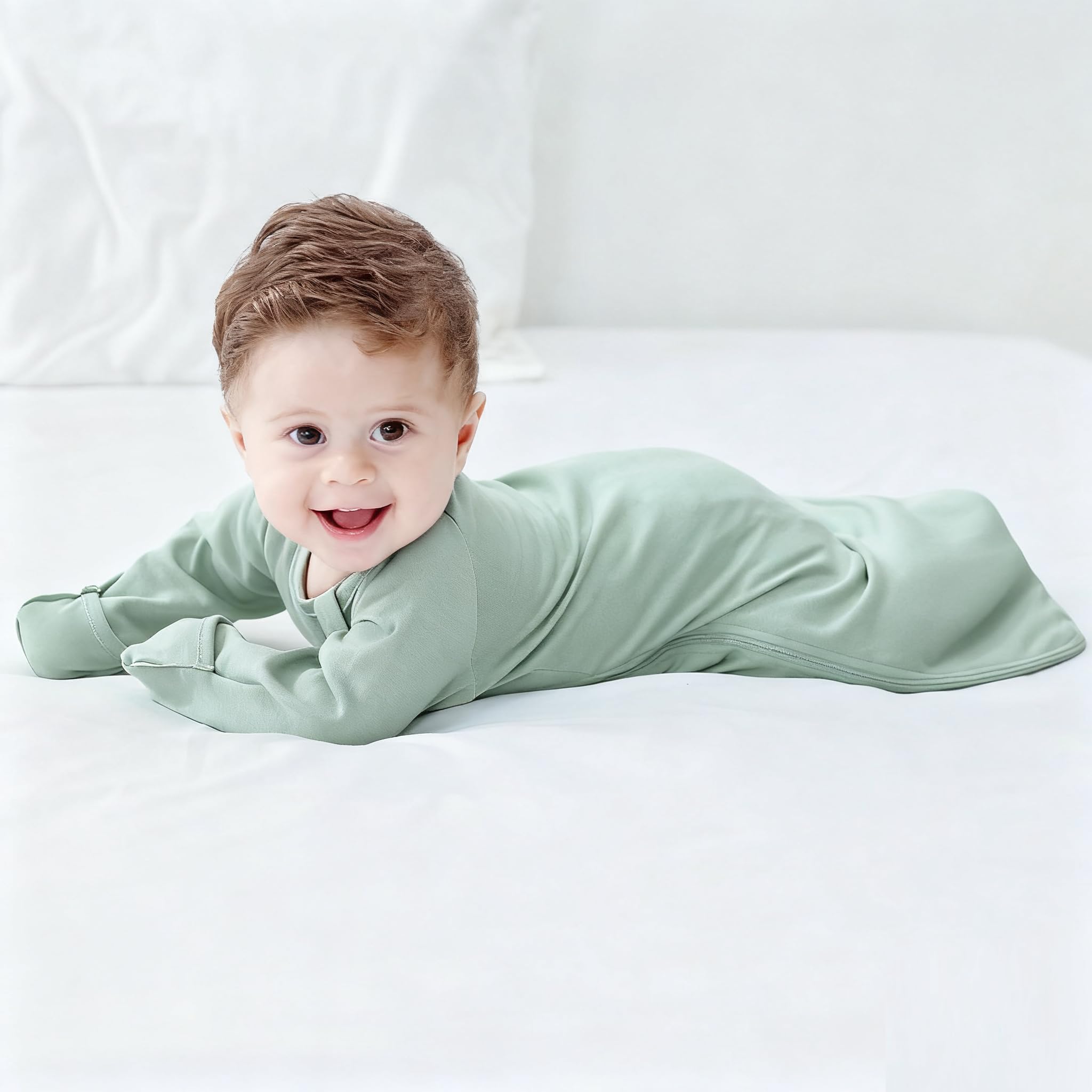 Knirose Swaddle Sack showing air-access as baby shifts onto tummy.