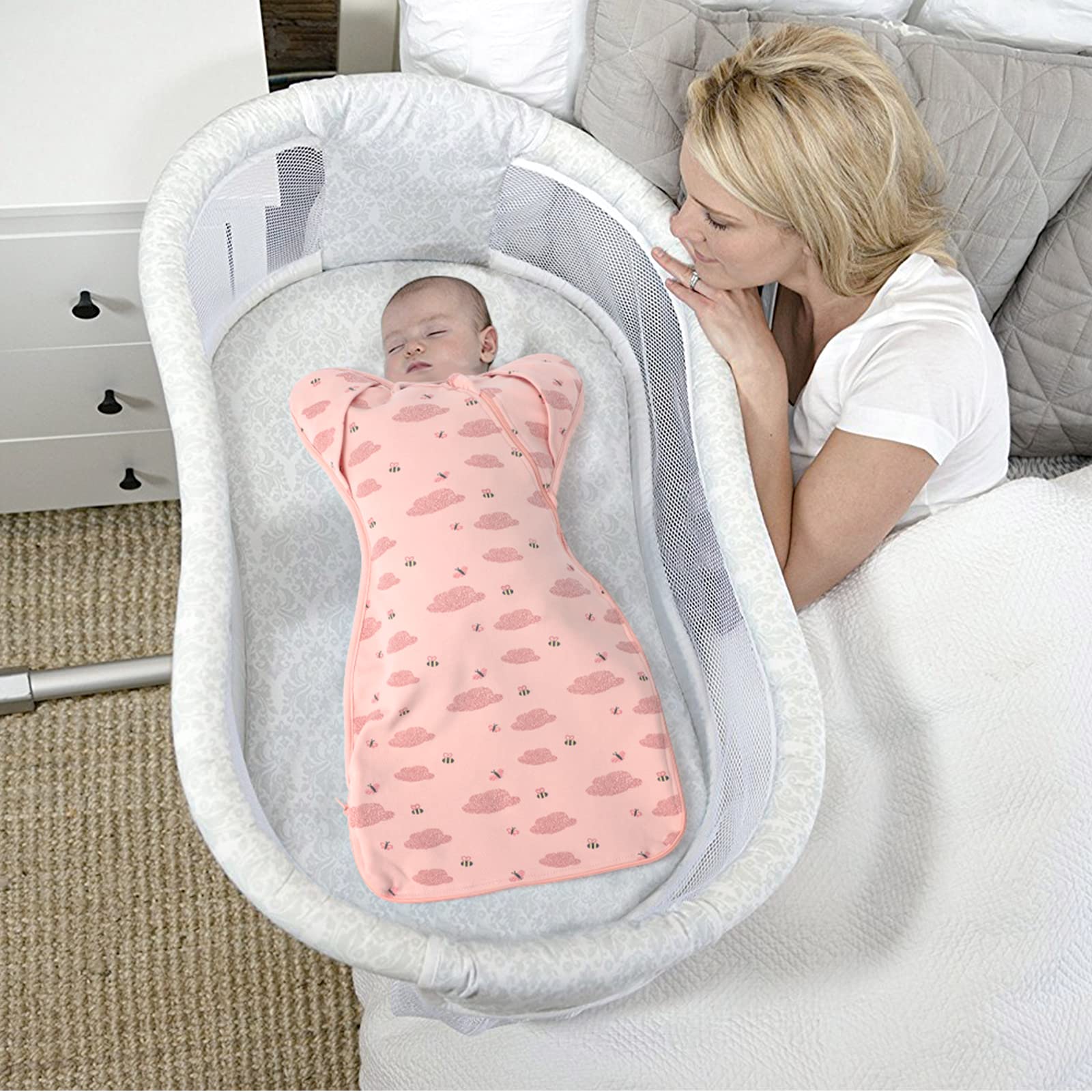 Knirose newborn calm swaddle in crib suggests a peaceful sleep environment.
