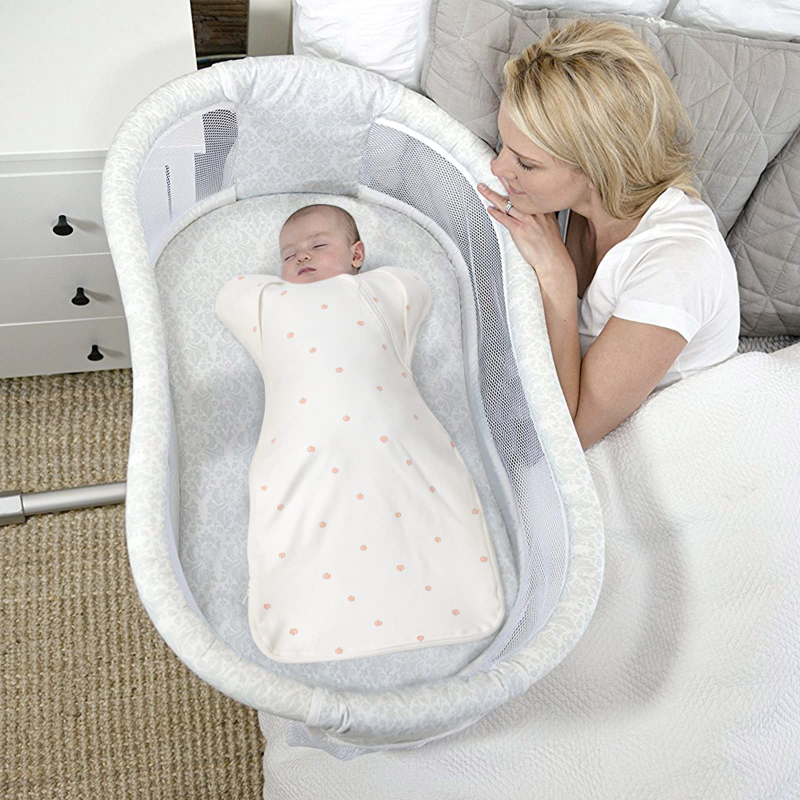Knirose soft cotton blend swaddle rests softly on crib side for cozy sleep.