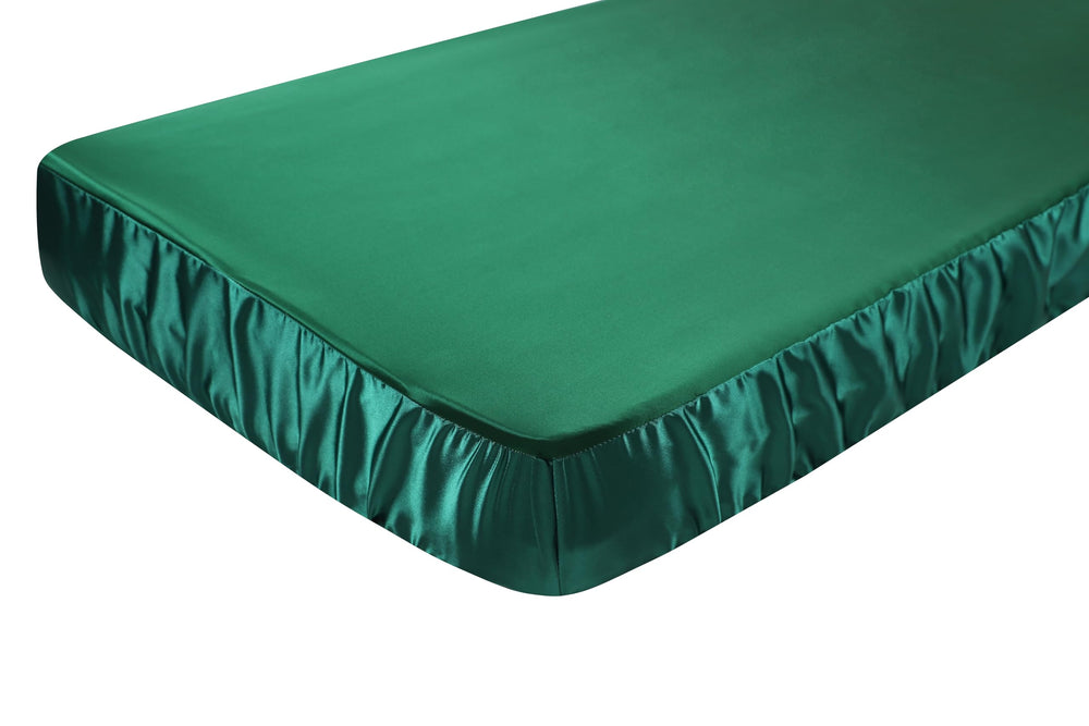 Knlpruhk dark green fitted sheet complements nursery decor.