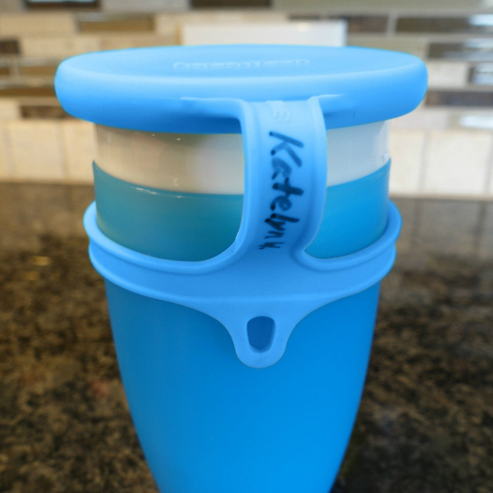 Koaii Baby lids on a diaper bag demonstrate travel-friendly leak prevention.