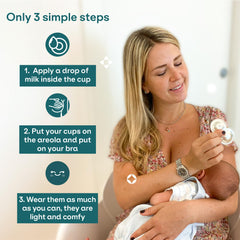 Koala Babycare silver nursing cups in use under bra for comfort.