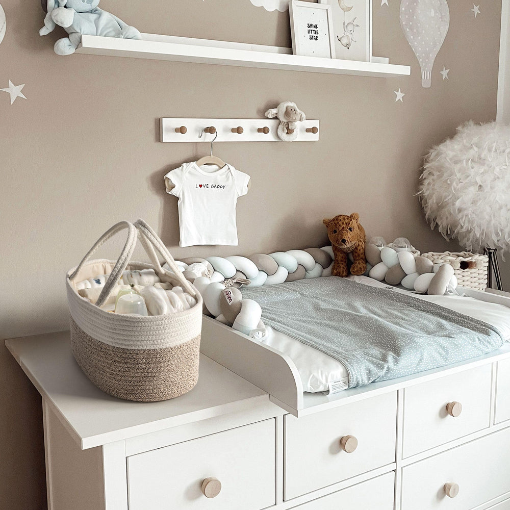Kodomoore diaper caddy foldable handles enable easy transport between rooms.