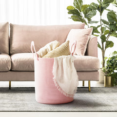 Kodomoore laundry basket with folded handles up demonstrates easy portability.