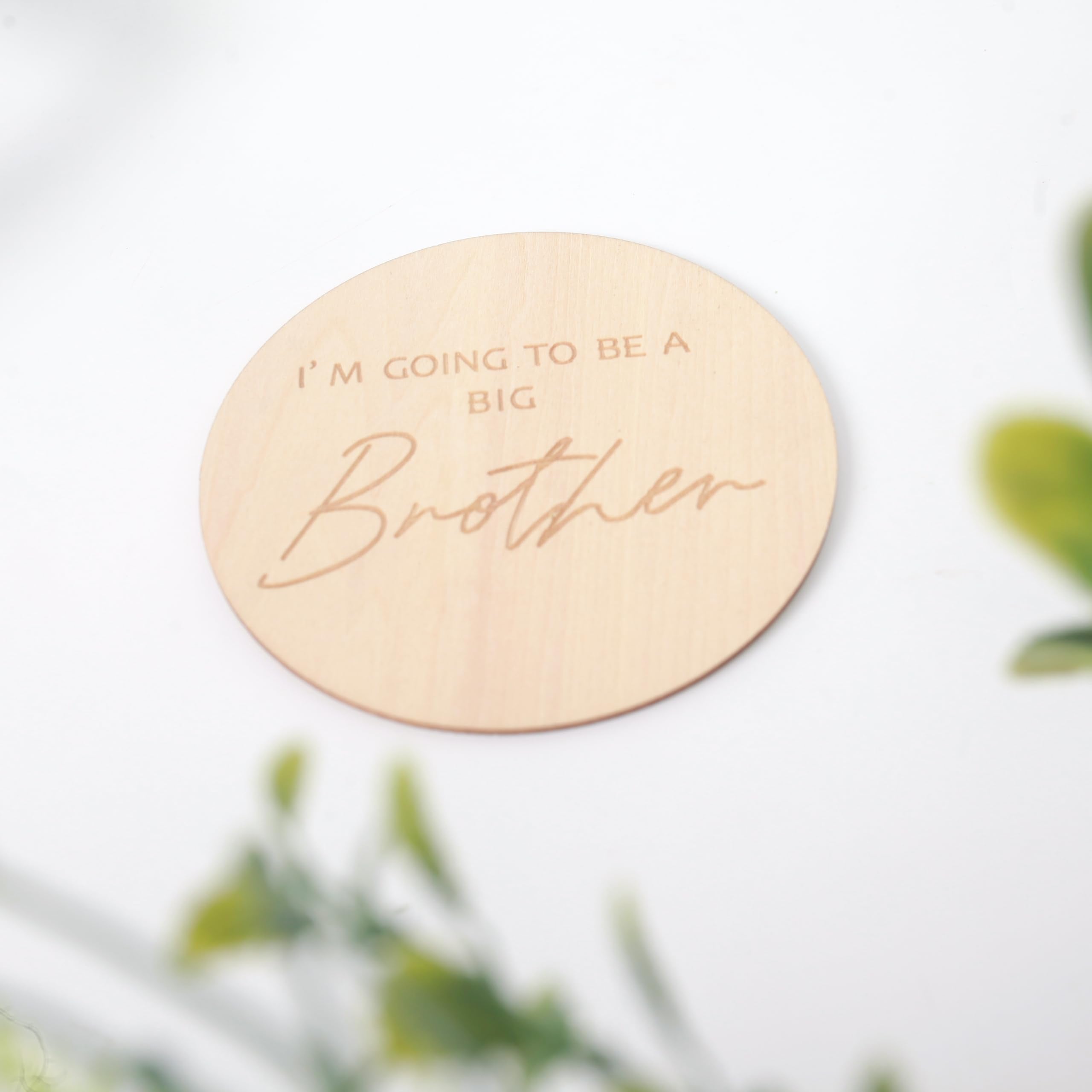 KOJIN photo prop plaque helps capture cherished milestones during newborn sessions