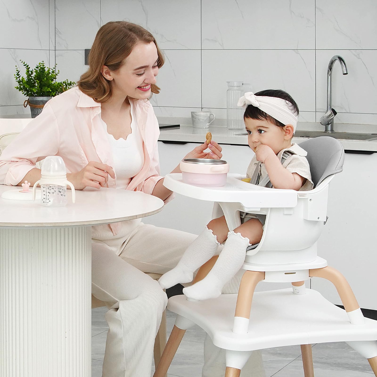 Komcot high chair table and chair set supports meals and learning at once.