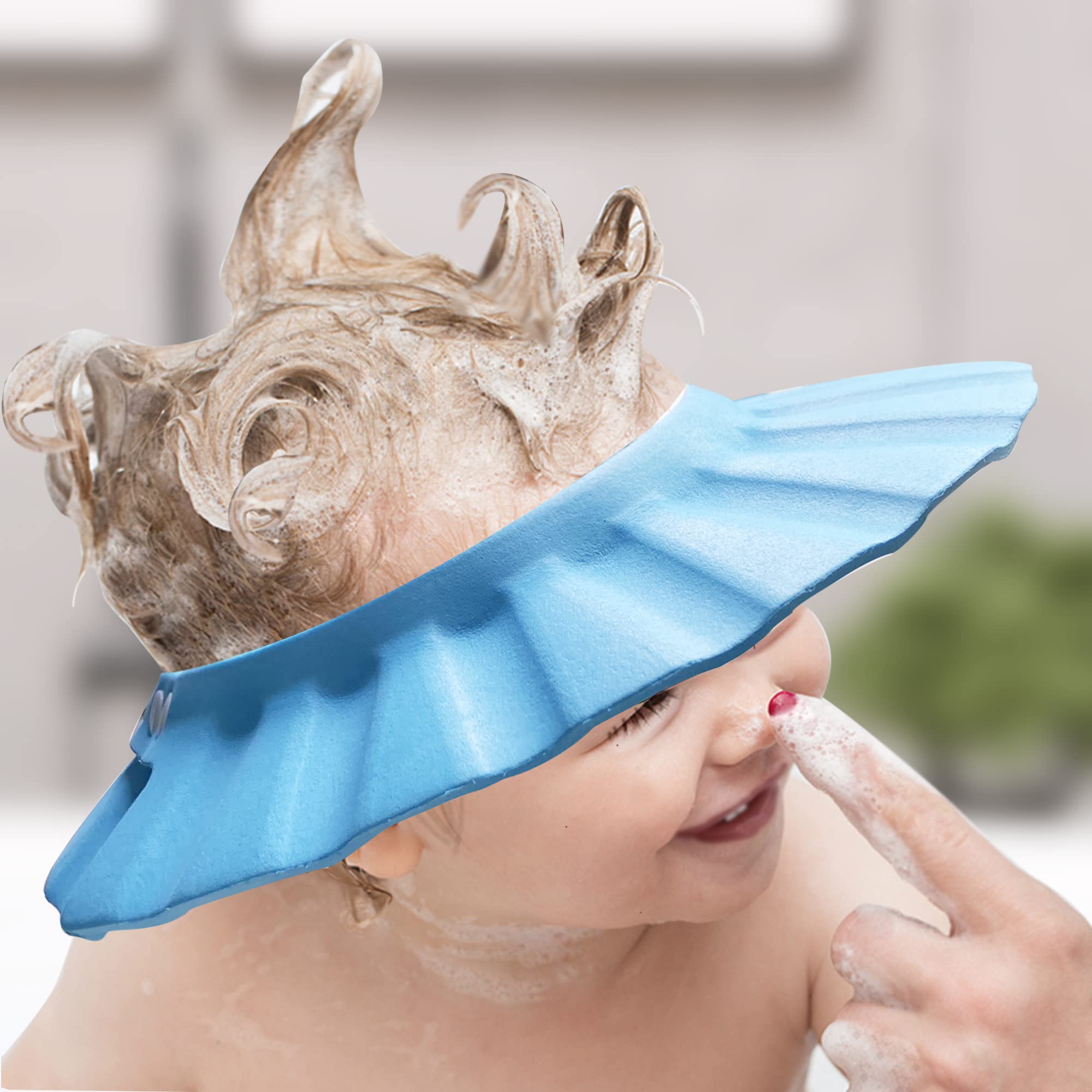 KOMIDK blue baby shower cap for toddlers during hair washing.