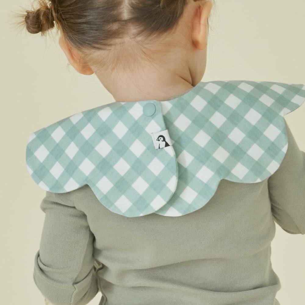 Konny Baby Bibs 360° rotate snap-forward view showcases outfit-ready styling.