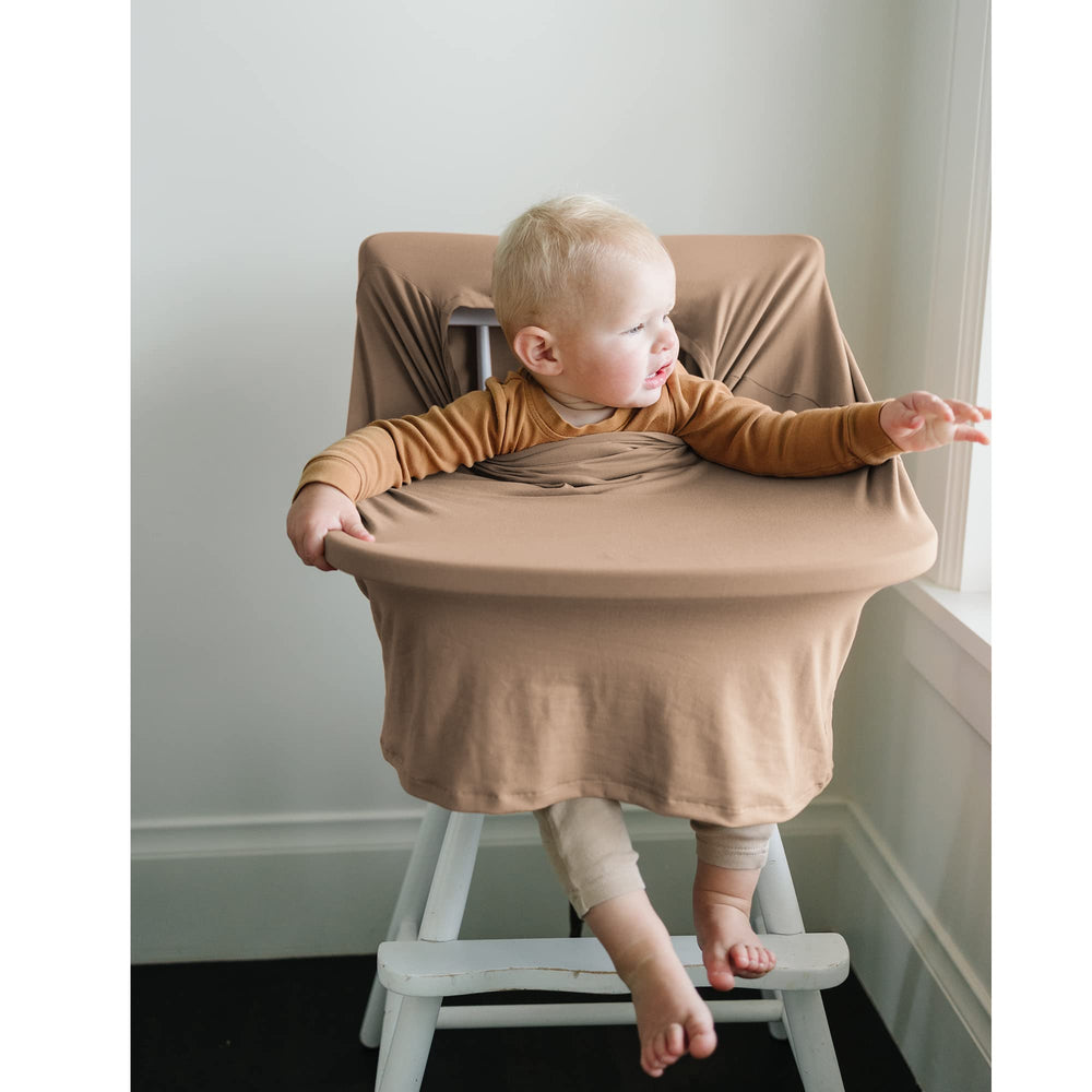 Konssy 360-degree full-coverage car seat cover shields baby and parent during outings.