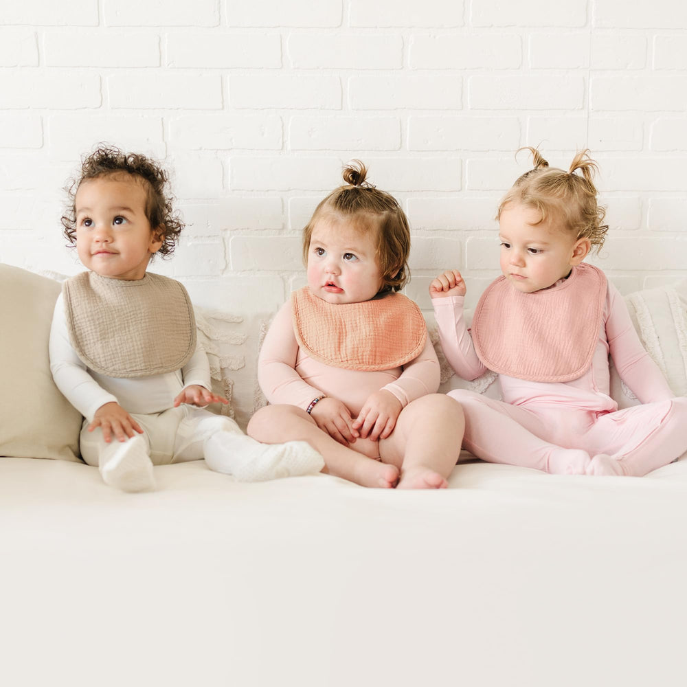 Konssy muslin bibs back view highlights comfort fleece backing and quick absorbency