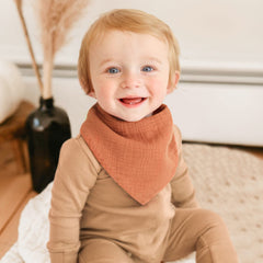 Konssy adjustable snap bibs featuring neck-friendly fit for growing babies.