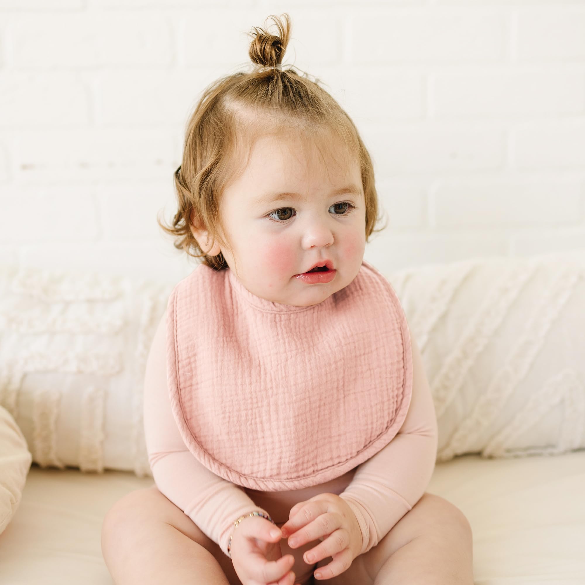 Konssy bibs shown as burp cloths for convenient daily care.