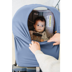 Konssy car seat cover doubles as a sunshade for baby carriers.