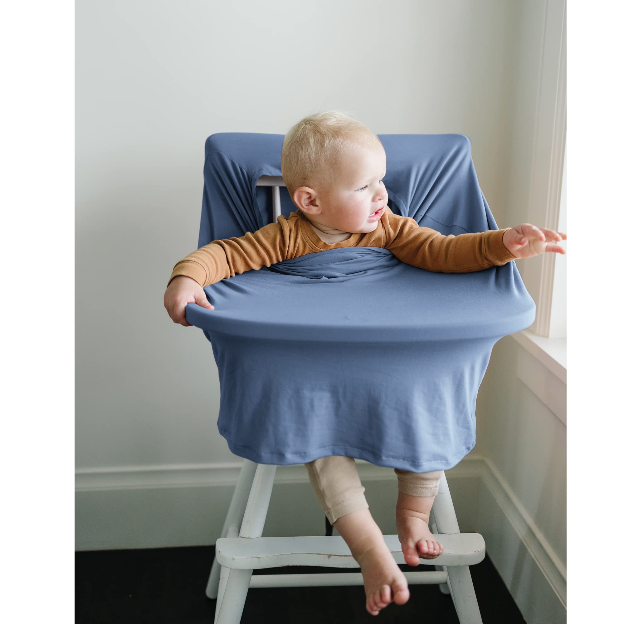 Konssy cover serves as a high chair cover for meals on the go.