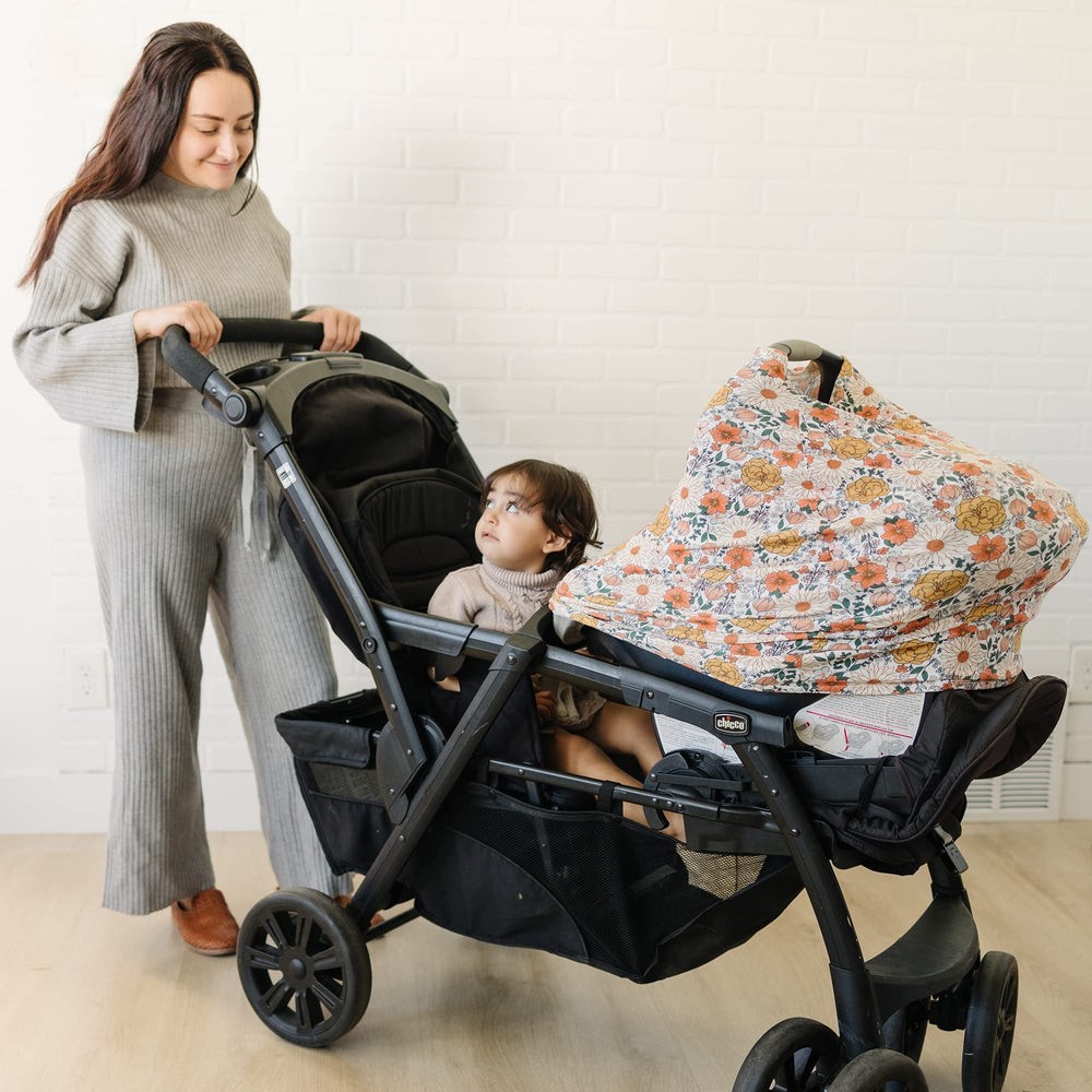 Konssy car seat cover shows stretchy fabric for easy quick installation.