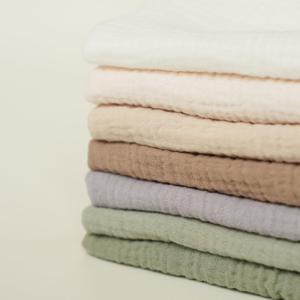 Absorption closeup on Konssy muslin washcloths highlights quick moisture pickup.