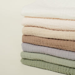 Absorption closeup on Konssy muslin washcloths highlights quick moisture pickup.