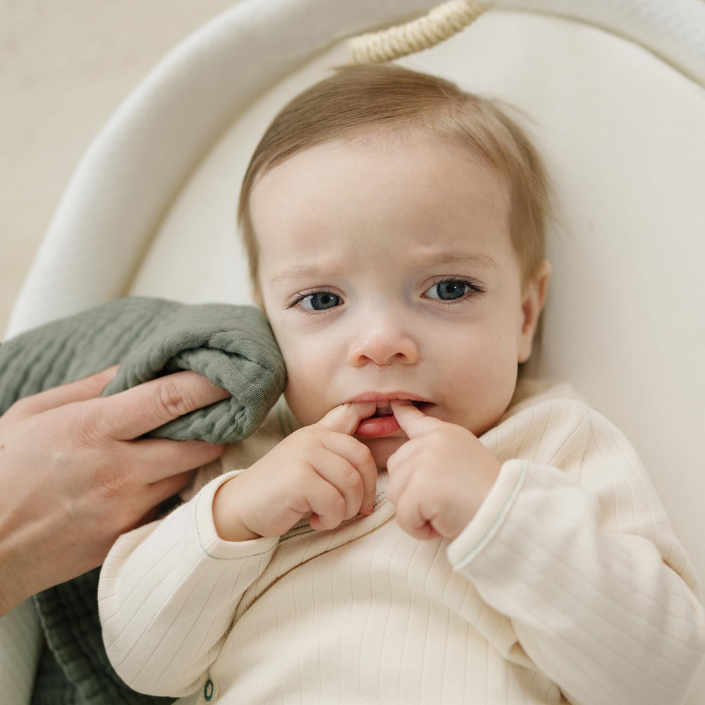 Konssy washcloths shown as burp cloth alternative for gentle spill cleanup.