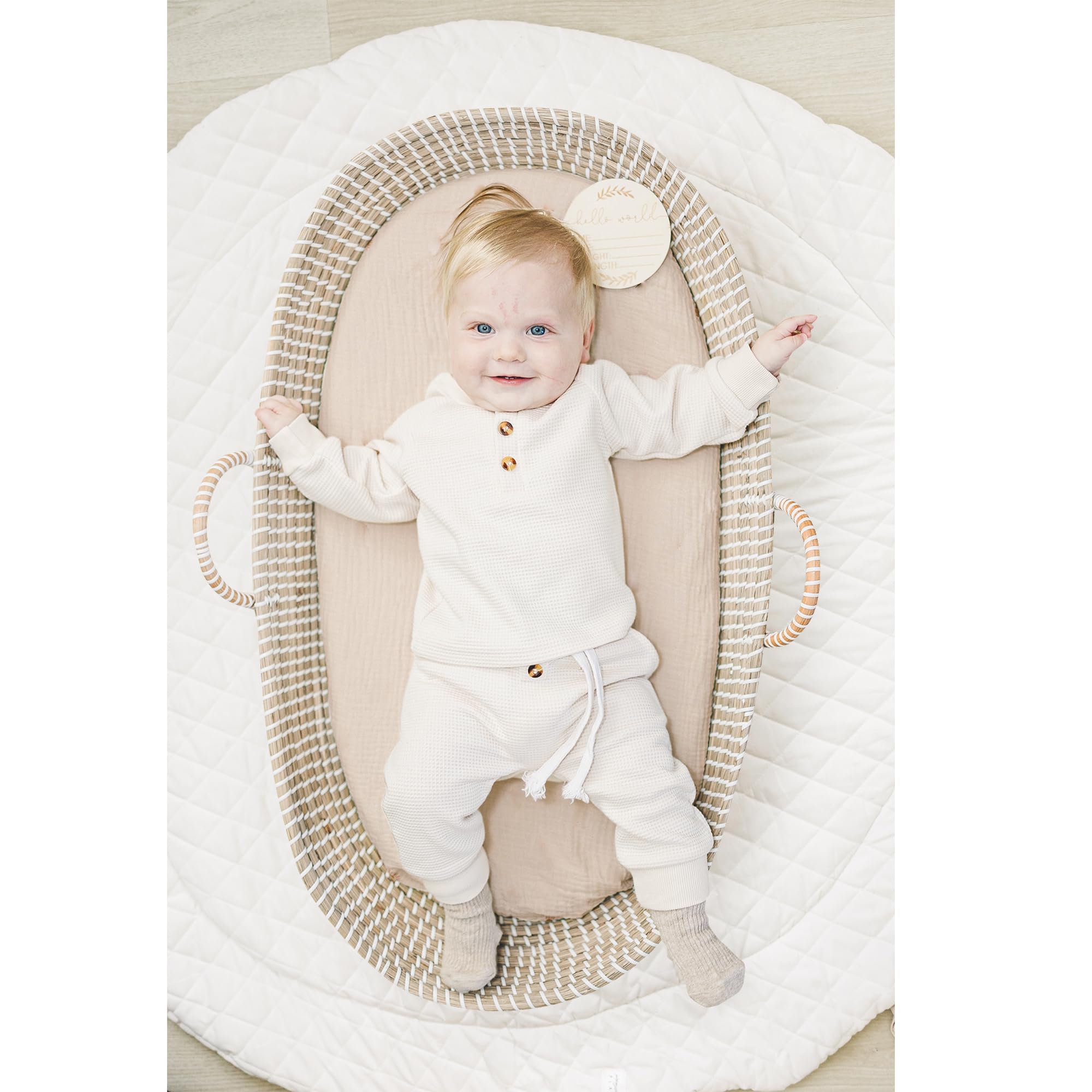 Konssy navy and cream style sheets match most nurseries with neutral tones.