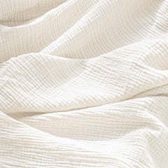 Konssy burp cloths shown in multi-use setup as bibs or towels.