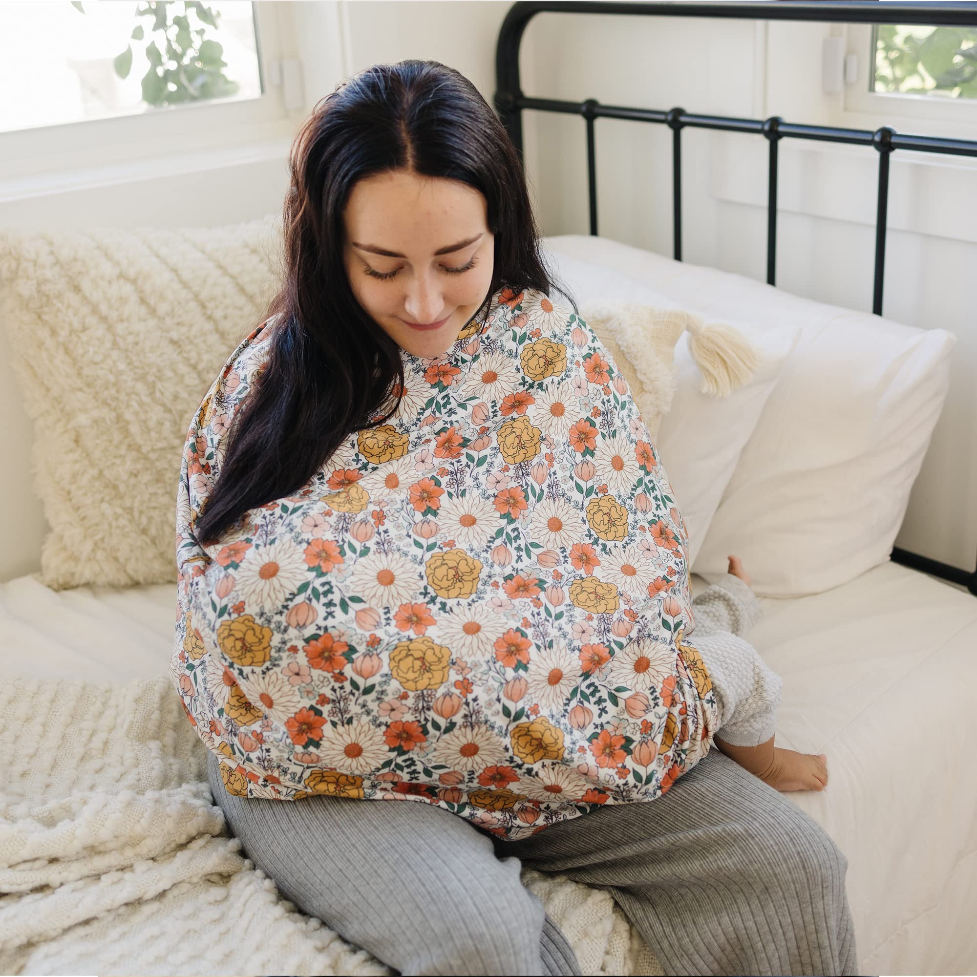 Konssy car seat cover demonstrates multiple uses as canopy, sunshade, and cart cover.