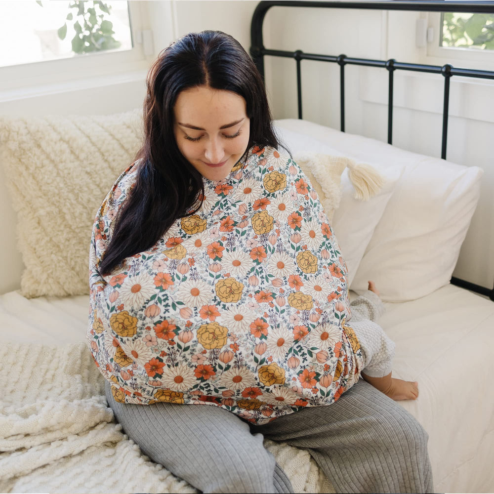 Konssy car seat cover demonstrates multiple uses as canopy, sunshade, and cart cover.