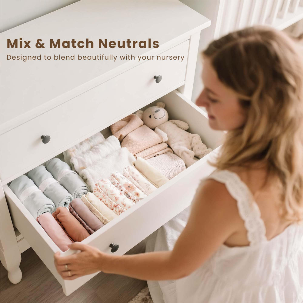 Konssy pink spring cover adds baby-nursery style and comfort to the changing station