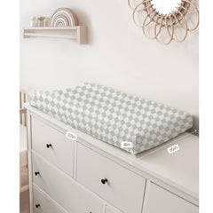 Konssy changing pad cover elastic edge fit ensuring secure changes.