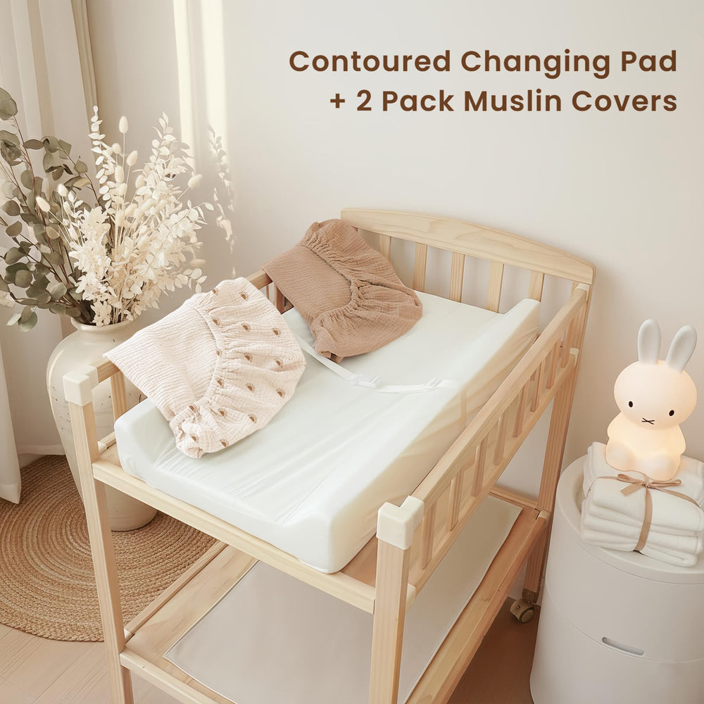 Konssy changing pad quick-release straps simplify securing baby during changes