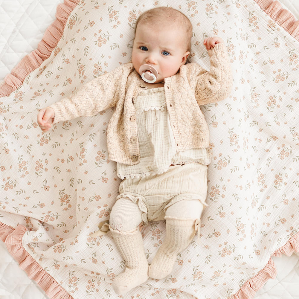 Konssy Flounce Muslin Blanket used as stroller cover for on-the-go shade