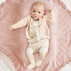 Konssy Flounce Muslin Blanket used as stroller cover protects from sun and wind.