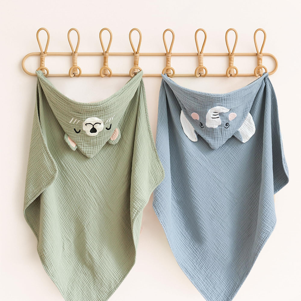 Konssy hooded towel on stroller illustrates portable bath accessory for travel