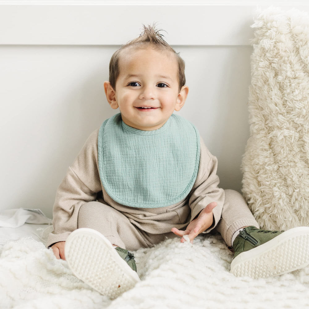 Konssy Muslin Baby Bibs used as burp cloths for soothing feed time cleanups.