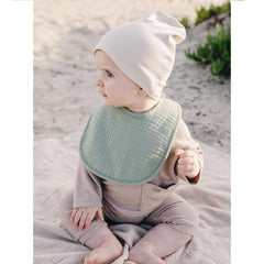 Konssy Muslin Baby Bibs laid flat demonstrating multi-use as bib, burp cloth, wipe.