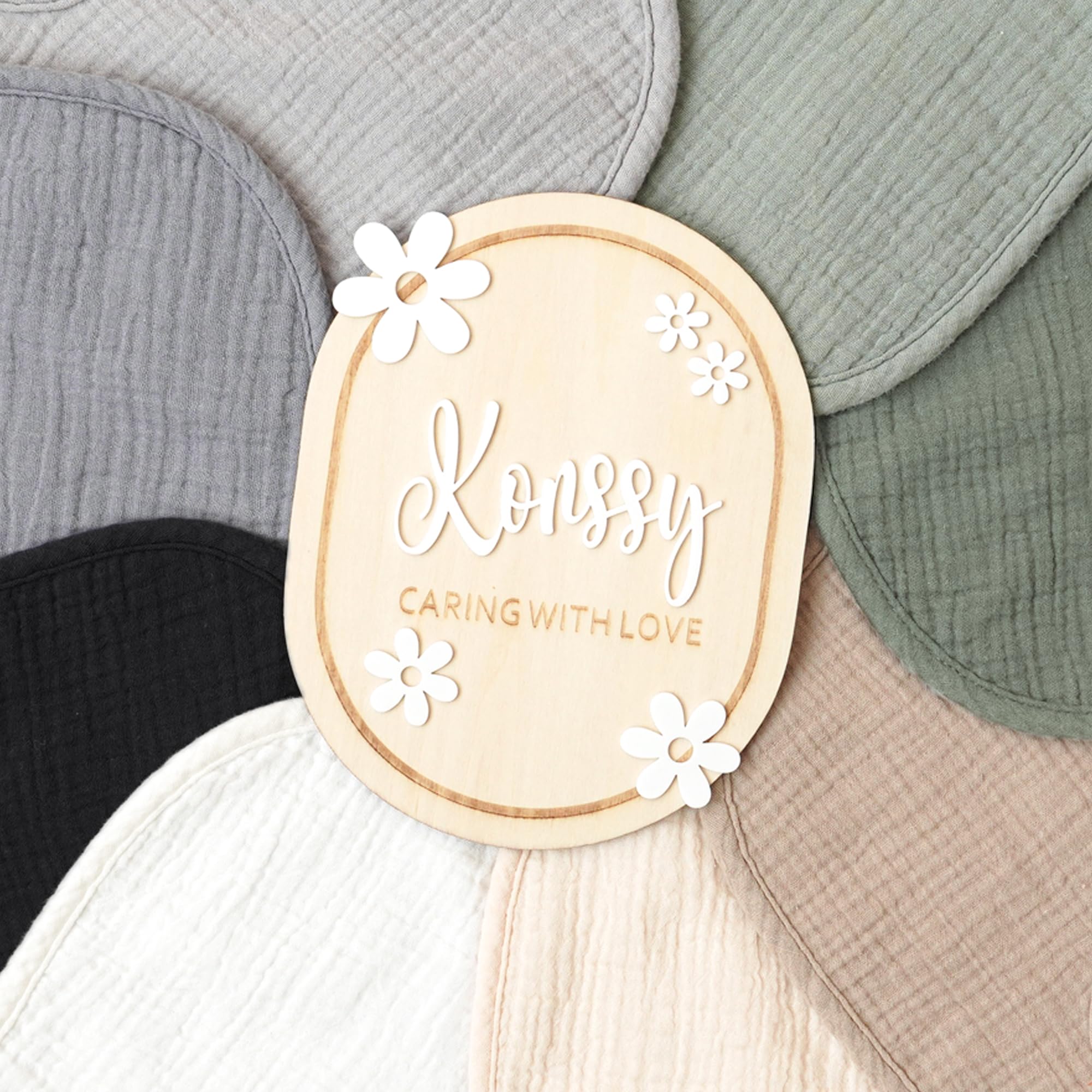 Konssy Muslin Baby Bibs in unisex colors coordinated with outfits.