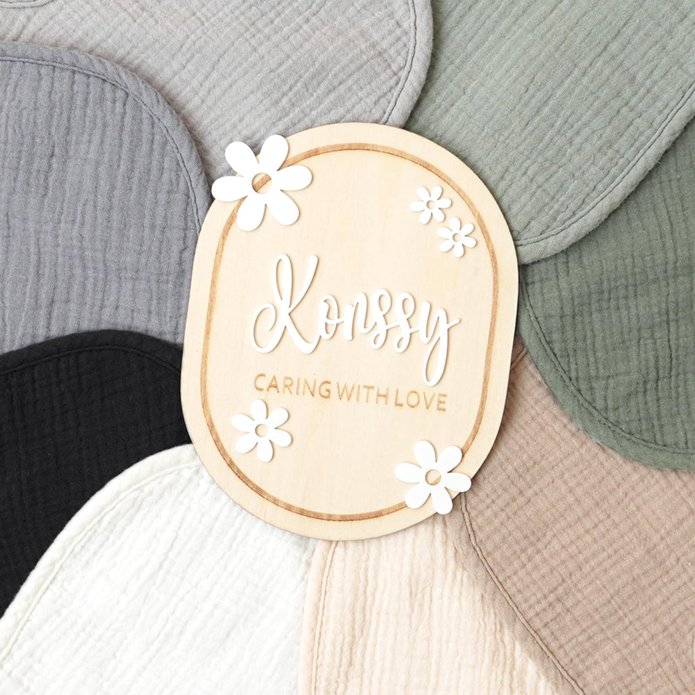 Konssy Muslin Baby Bibs in unisex colors coordinated with outfits.